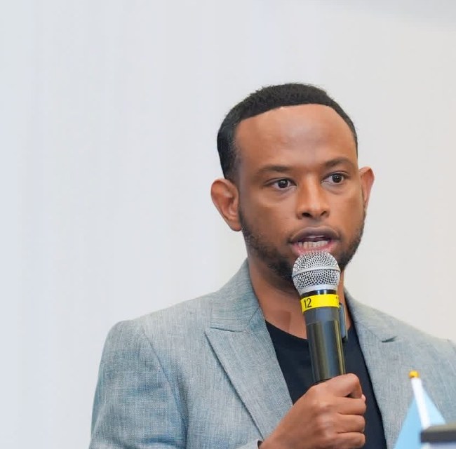 Abdihakim Ibrahim speaking at a community event